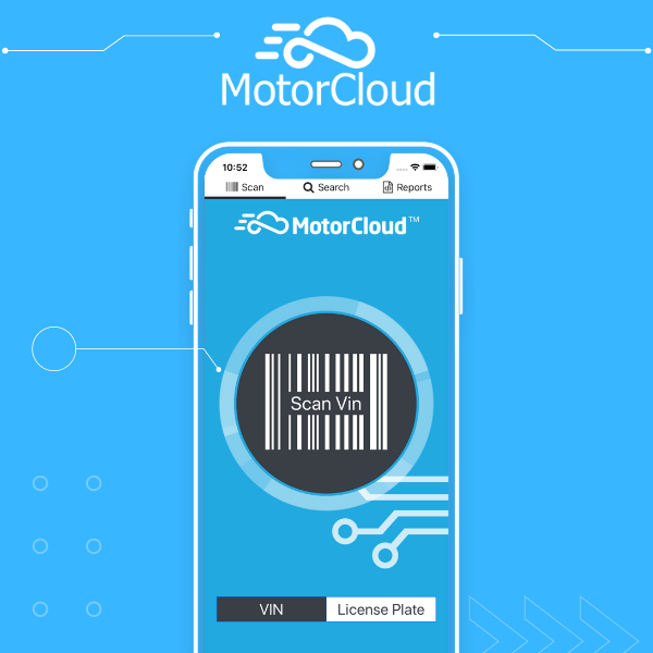 Wood table with porcelain mug, leather journal, brass pen, leather key ring, and a houseplant.